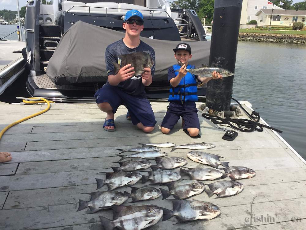 Youngsters holding up a great catch of Spades